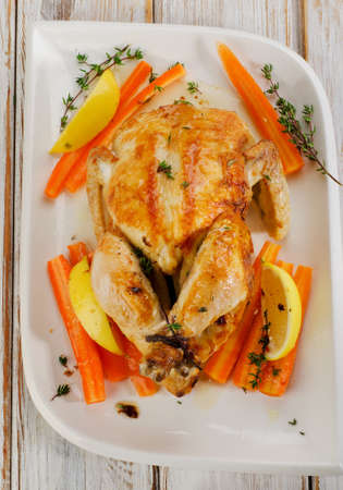 Whole Roasted chicken  on   white plate. Selective focusの写真素材