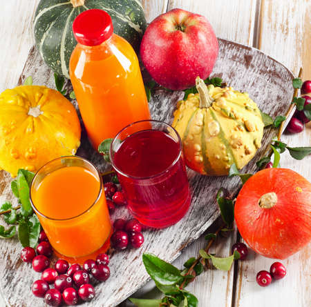 Healthy fresh Juices, fruits  and pumpkins - autumn still life. Selective focusの写真素材