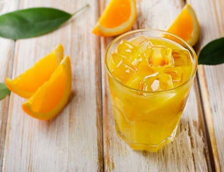 Orange juice  on  a  wooden background. Selective focusの写真素材