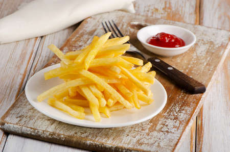 Fries on  a wooden table . Selective focusの写真素材