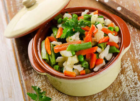 Mixed vegetables in  bowl on  wooden background. Selective focusの写真素材