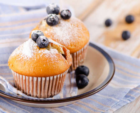 Muffins with  blueberries on a wooden table. Selective focusの写真素材