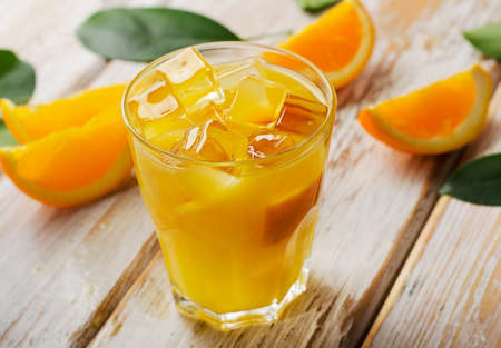 Orange juice  on   wooden background. Selective focusの写真素材