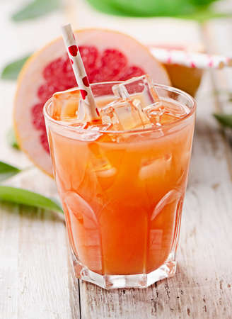Glass of fresh pink grapefruit juice. Selective focusの写真素材