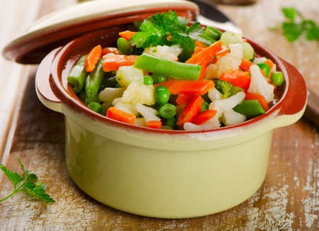 Mixed vegetables in  bowl on a  wooden board. Selective focusの写真素材