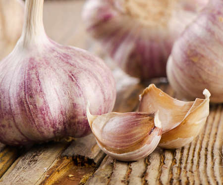 garlic whole and cloves on   wooden board. selective focusの写真素材