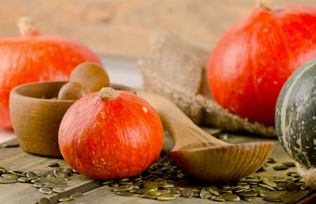 Mixed Pumpkins and seeds  on  wooden table. Selective focusの写真素材