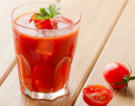 Tomato Cocktail  on a wooden table. Selective focusの写真素材