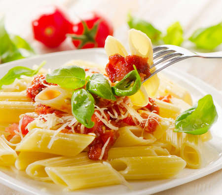 Italian Pasta with bolognese sauce and basil.  Selective focusの写真素材