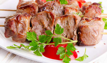 Pork kebabs served on  white plate. Selective focusの写真素材