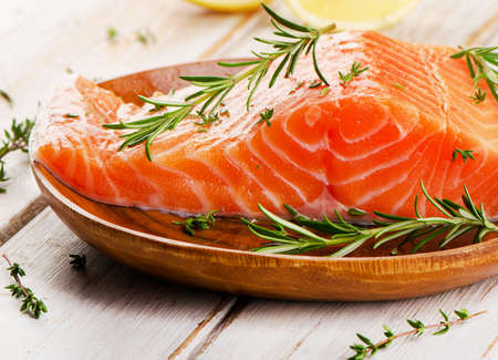Salmon fillet on wooden background. Selective focusの写真素材