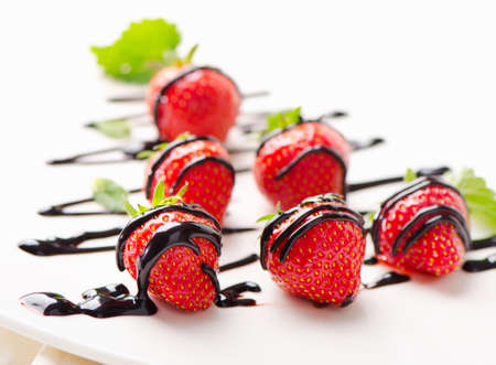 Fresh strawberries  in chocolate sauce . Selective focusの写真素材