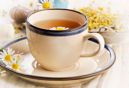 Tea with chamomile flowers. Selective focusの写真素材