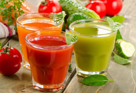 Fresh vegetables  juices on  wooden table. Selective focusの写真素材