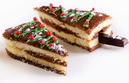 Slices of Christmas cake  on a white plate .の写真素材