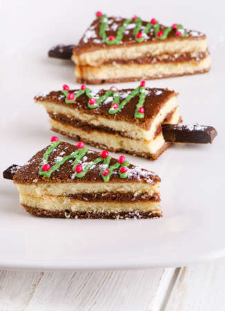 Slices of Christmas cake  on  white plate .の写真素材