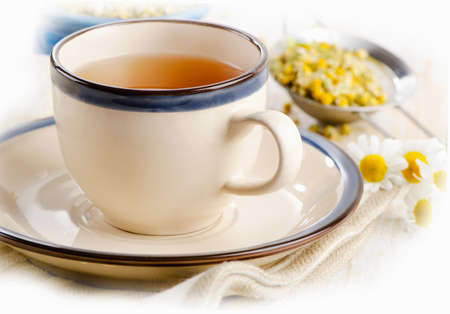 Herbal tea with chamomile flowers. Selective focusの写真素材