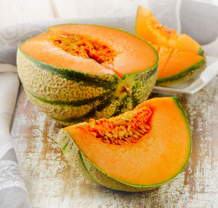 Fresh cantaloupe melon on a  table. Selective focusの写真素材