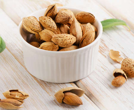 Almonds nuts in the white bowl. Selective focusの写真素材