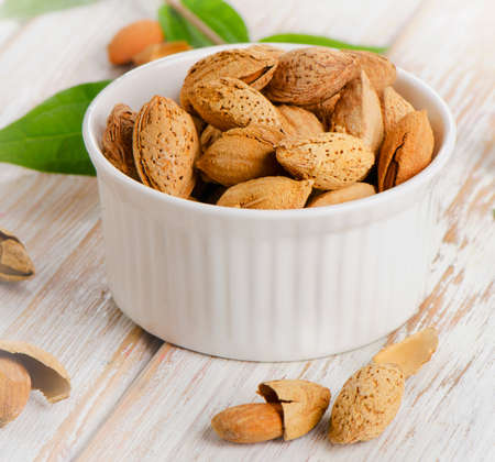 Almonds  in the white bowl. Selective focusの写真素材