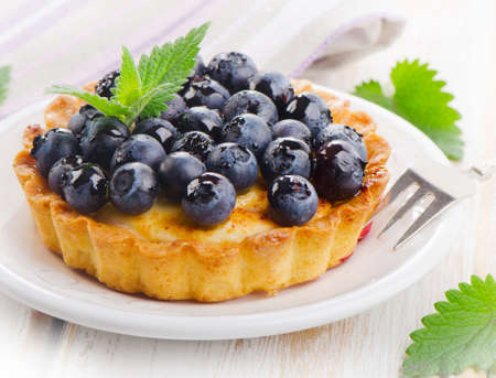 Fresh Blueberry tart on a white plate. Selective focusの写真素材
