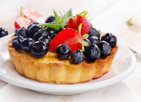 Fresh blueberry tart on  white plate. Selective focusの写真素材