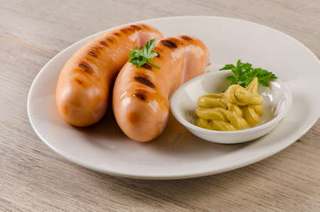 grilled sausages with mustard sauce. Selective focusの写真素材