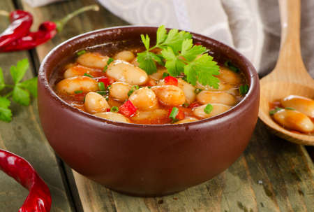 Baked beans in a  bowl on  wooden background . Selective focusの写真素材
