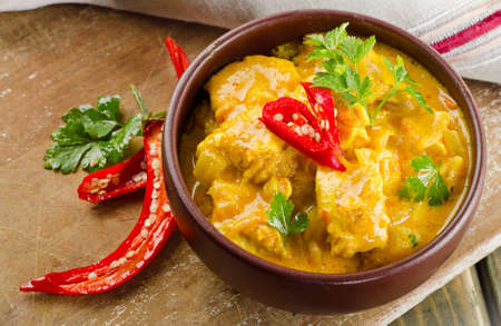 Chicken curry with  parsley in  a bowl . Selective focusの写真素材