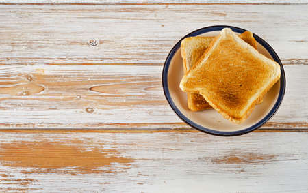 Two Slices toast bread on wooden background. Selective focusの写真素材