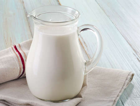 Milk  on wooden table. Selective focusの写真素材