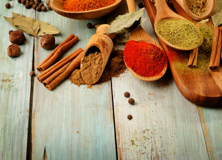 Various kind of  Spices on wooden spoons. Selective focusの写真素材
