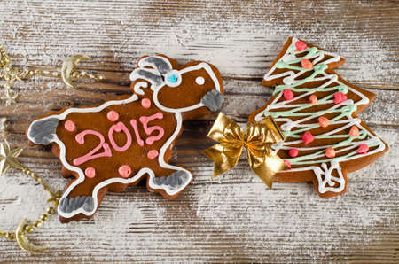 Sweet Christmas  goat and tree on a wooden tableの写真素材