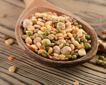 lentils on a wooden table .