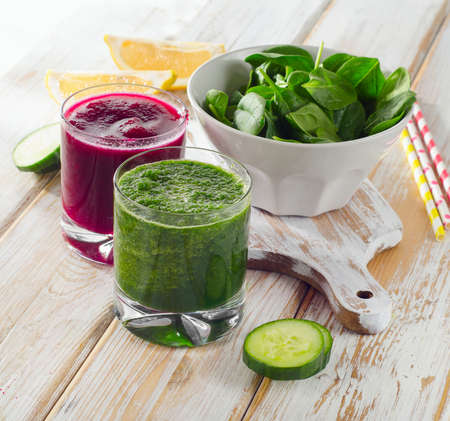 Freshly Squeezed Vegetable Juices on a wooden background.の写真素材