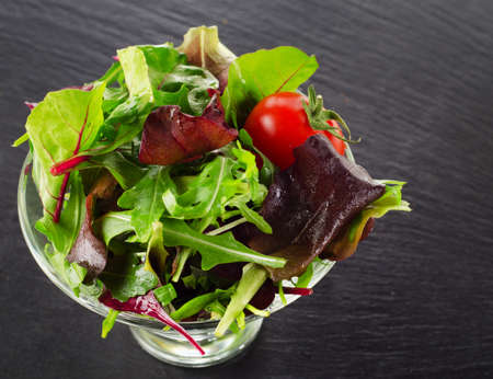 Fresh green salad with spinach,arugula and lettuceの写真素材