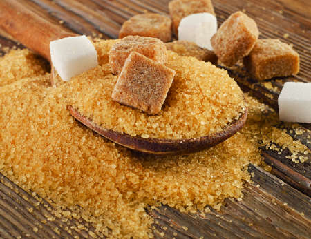 Brown cane sugar on   wooden board. Selective focusの写真素材