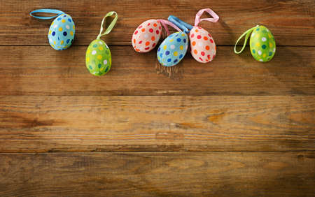 Easter eggs on rustic wooden background.の写真素材