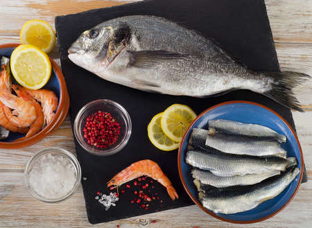 Fresh raw fish  with  spices , salt and shrimps - healthy food. Diet  concept.の写真素材