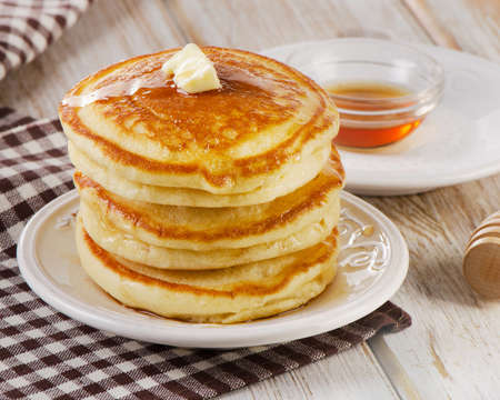 Stack of Small pancakes with a maple syrup.の写真素材