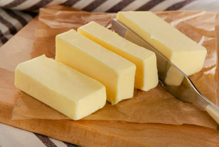 Butter on a  cutting board. Selective focusの写真素材