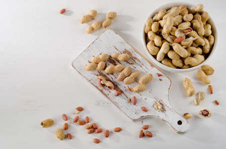 Peanuts in shells on   white background. Top viewの写真素材