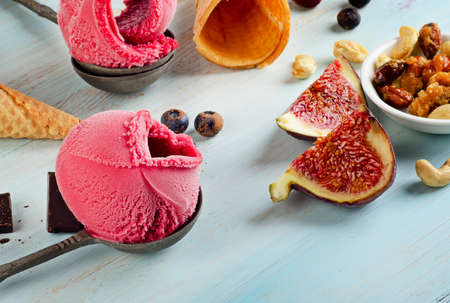 Ice cream on a spoon with fruits. Selective focusの写真素材