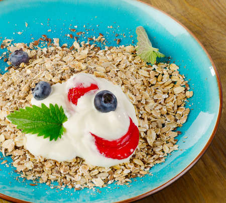 Breakfast with yogurt, berries and muesli. Selective focusの写真素材
