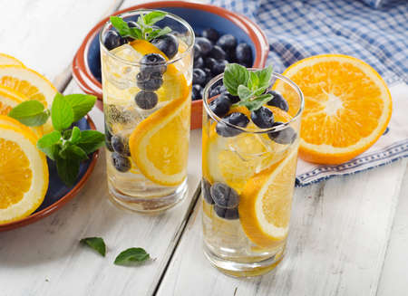 Fresh Detox water with orange and berries. Selective focusの写真素材