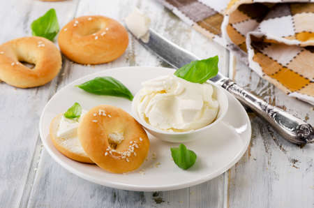 Fresh bagel with cream cheese for breakfast. Selective focusの写真素材