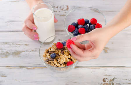 Glass of Yogurt with blueberries, raspberries and muesli for Healthy breakfast. Top viewの写真素材