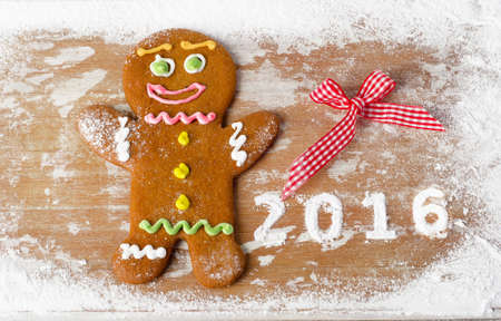 Gingerbread man on a wooden table. 2016 new year. Top viewの写真素材
