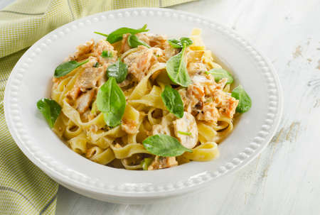 Pasta with mushrooms, spinach and cream sauce. Selective focusの写真素材
