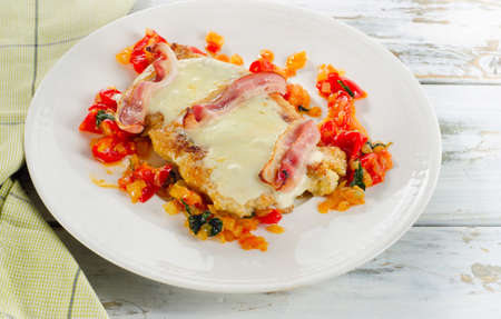 Chicken breast baked with cheese, bacon and tomato sauce. Selective focusの写真素材